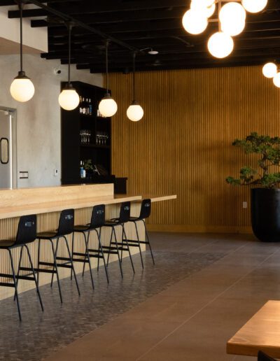 The interior of a restaurant with wooden tables and chairs.